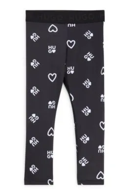 Leggings elásticos para niños con corazones y logos estampados